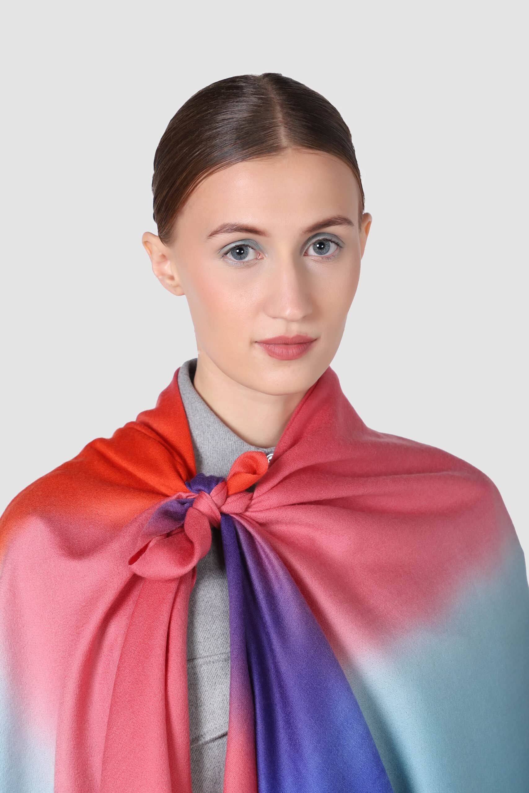 A woman draped in hand crafted multi colored belle ombre scarf - Me and K
