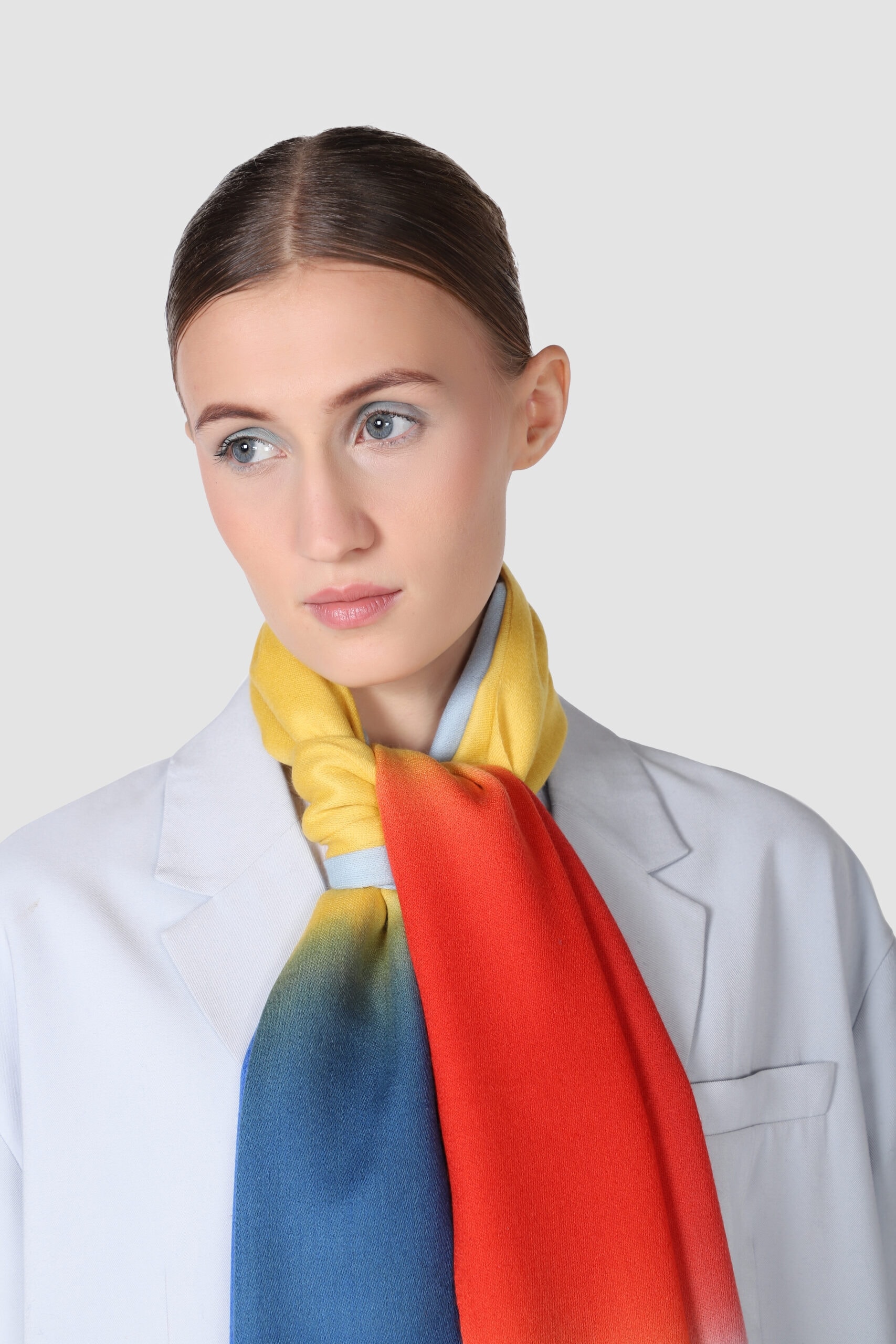 Close-up shot of a woman wearing four color ombre scarf - Me & K