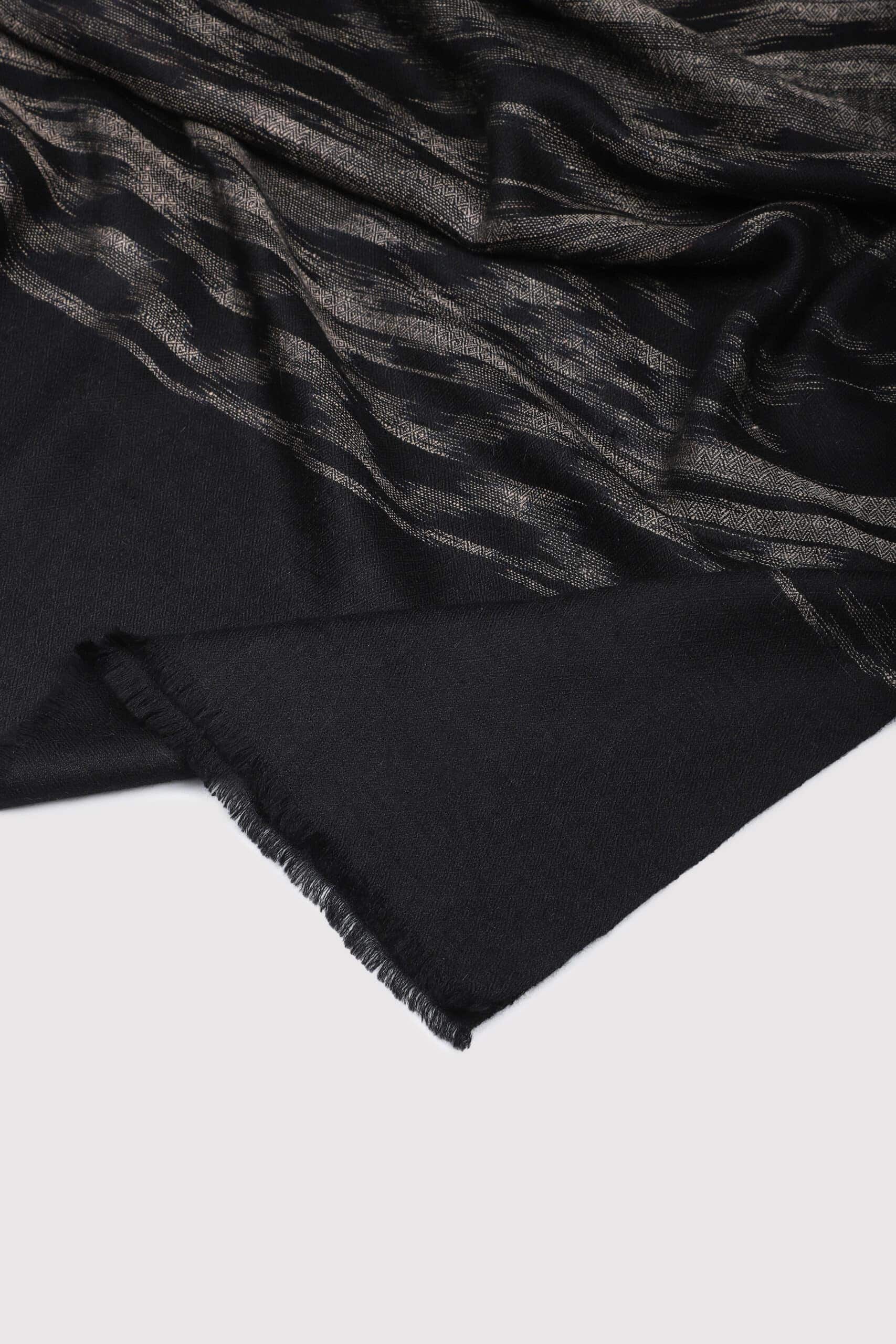 Black and grey colored Ikat shawl on a white background- Me & K
