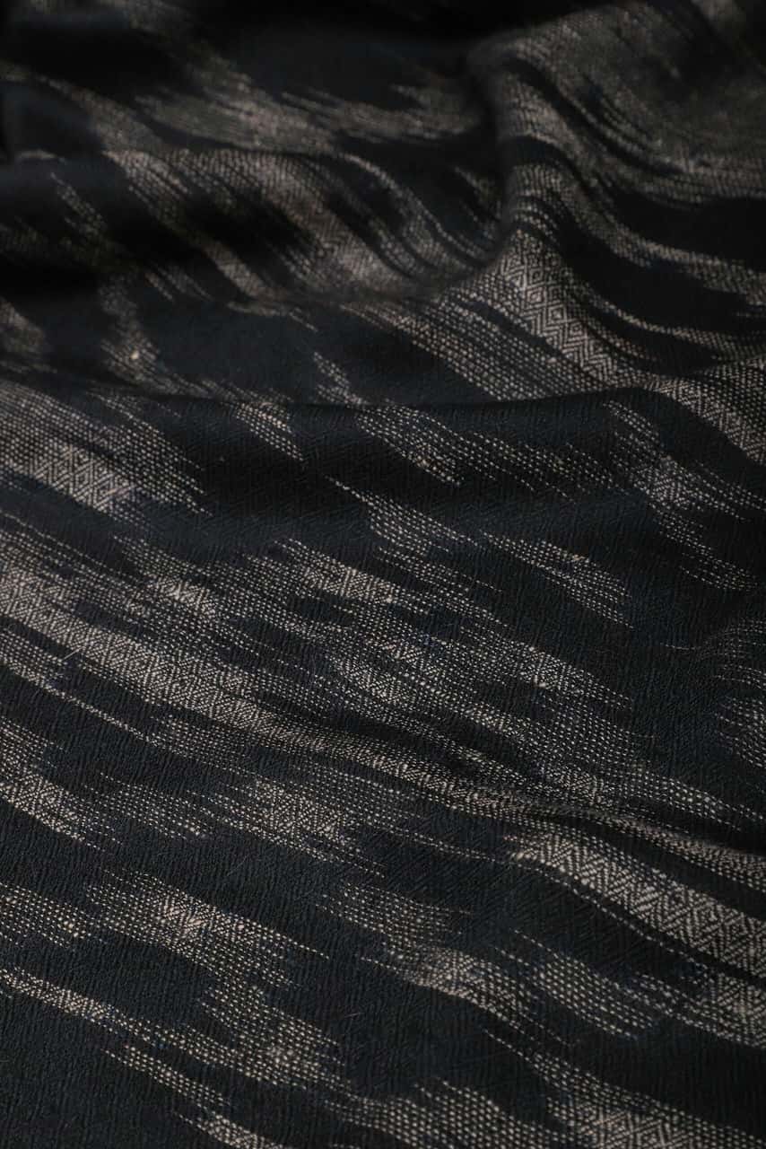 Close-up shot of handspun black & grey colored Ikat cashmere shawl - Me&K