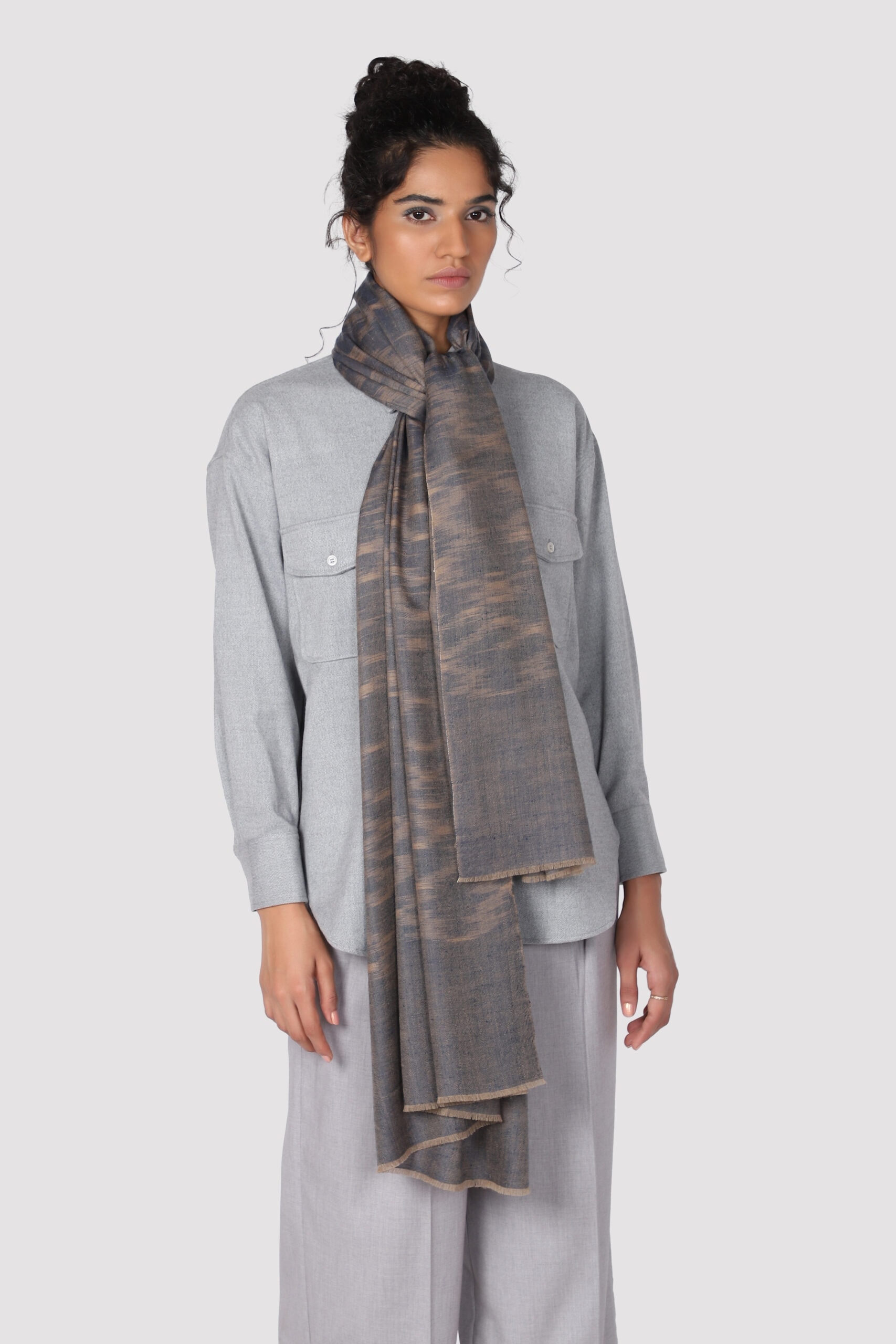 Full frame click of a woman wearing brown & blue colored Ikat cashmere shawl - Me & K