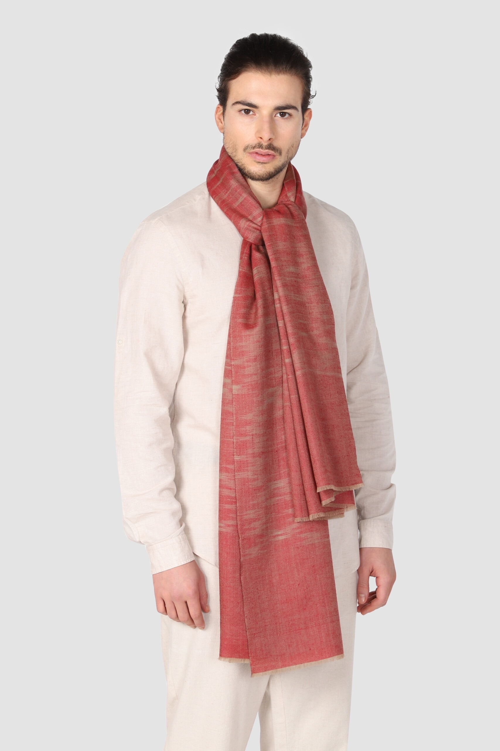 A man in ivory suit wearing Ikat Shawl in red & beige shade - Me and K