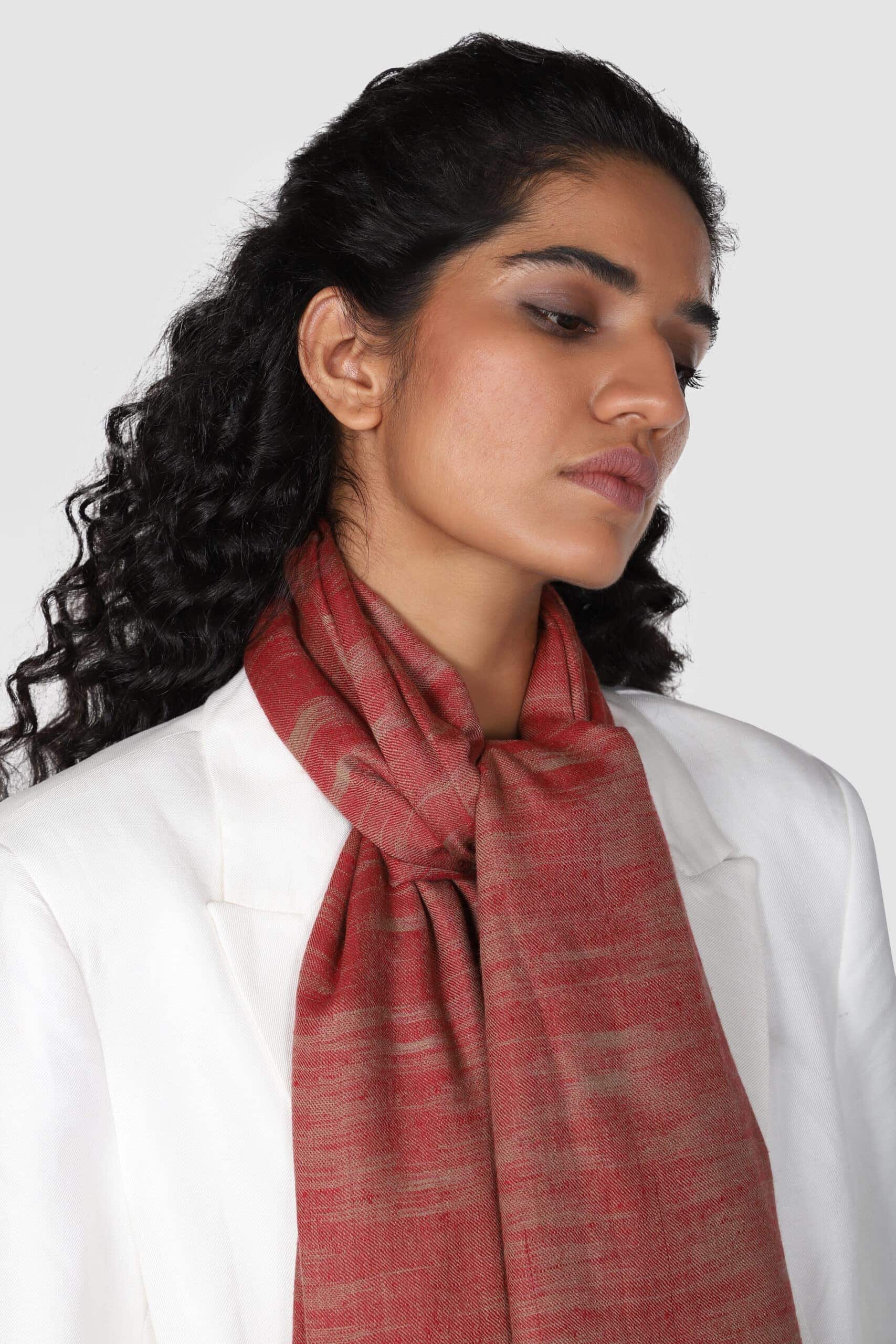 Close-up shot of model in red & beige colored Ikat cashmere shawl - Me&K