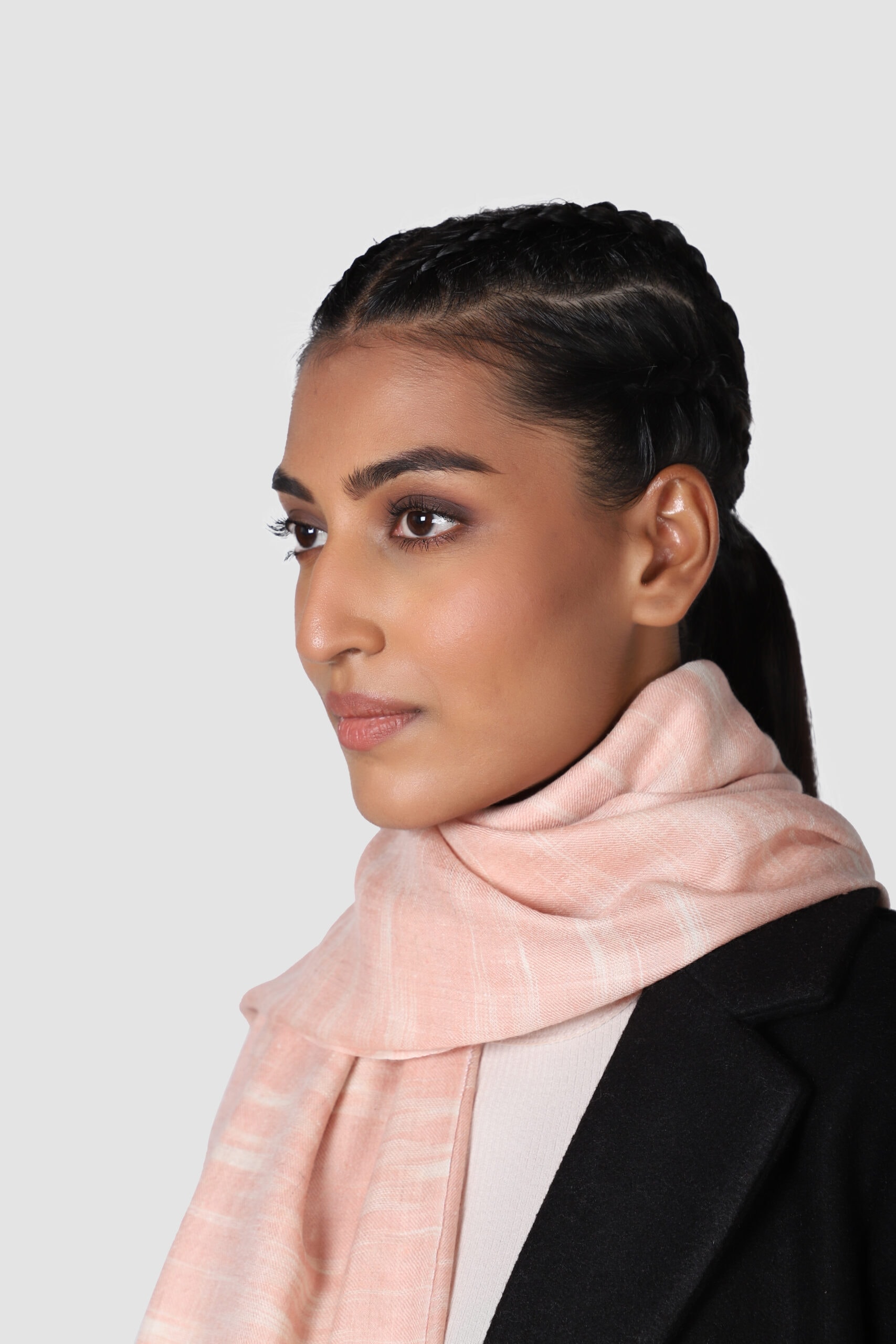 Close-up shot of woman in pink & white colored Ikat cashmere shawl - Me&K
